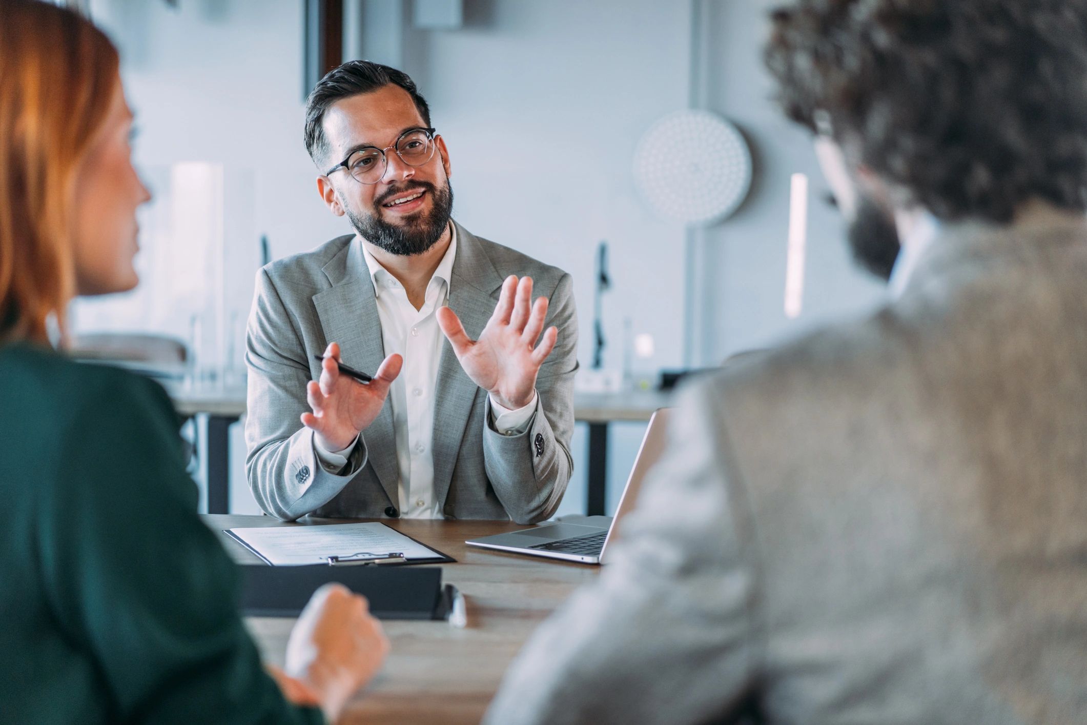 professional mortgage broker meeting client modern office